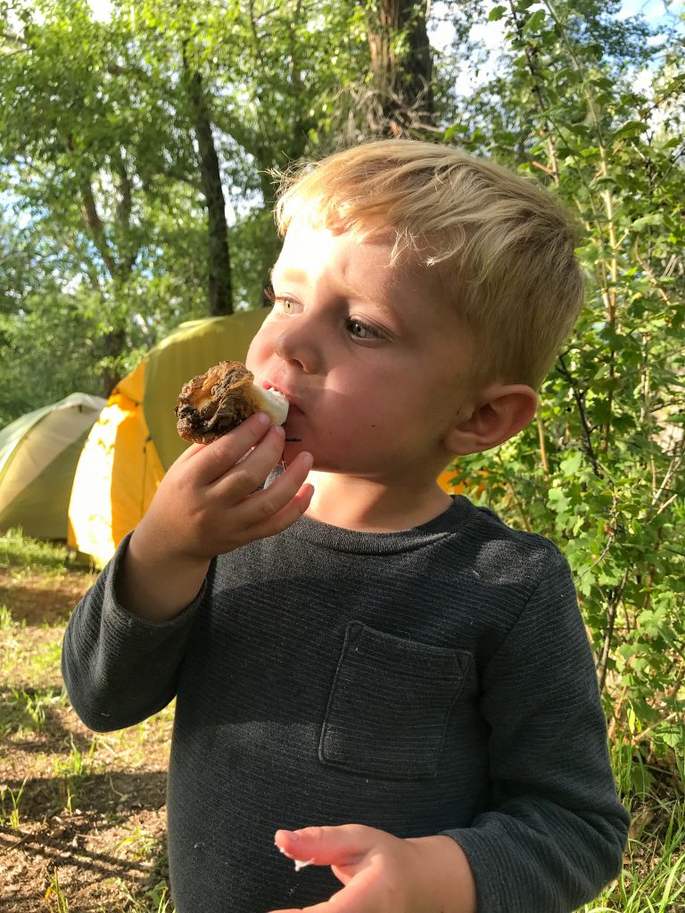 little boy eating smores