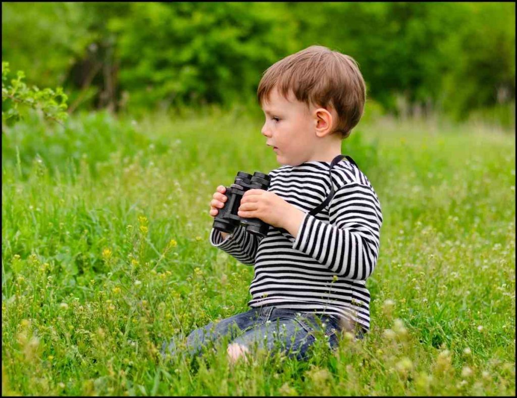 little boy with binoculars