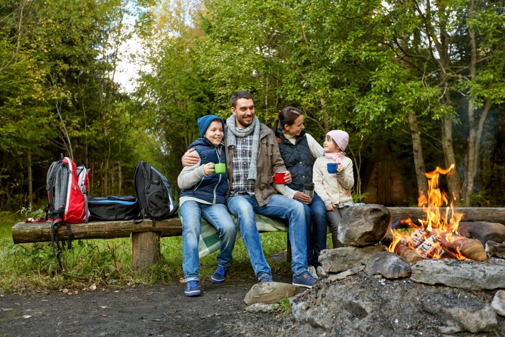 happy family enjoys drinking out of incredible camping mugs